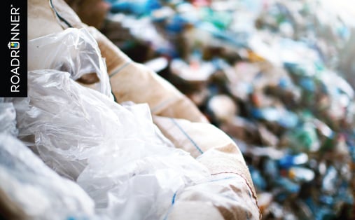 a pile of plastic bags located in a landfill