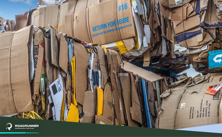 Compressed and bailed cardboard recycling