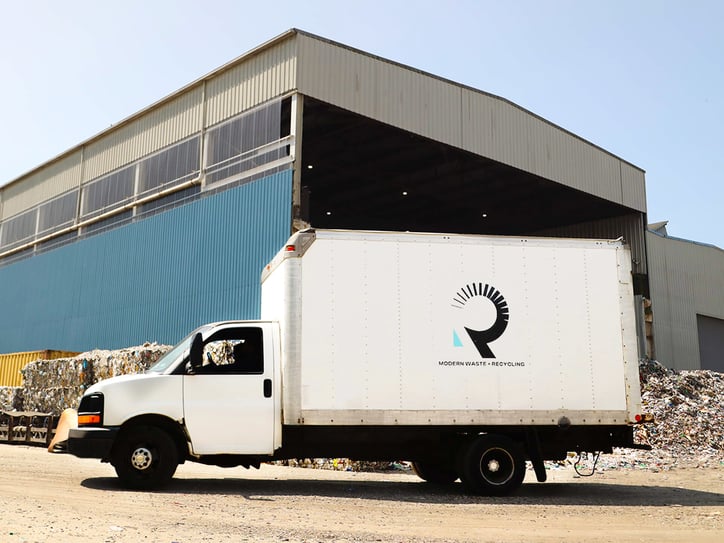 White box truck at a recycling center