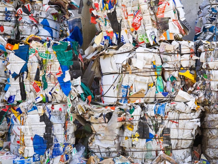 Stacked bales of recycled paper